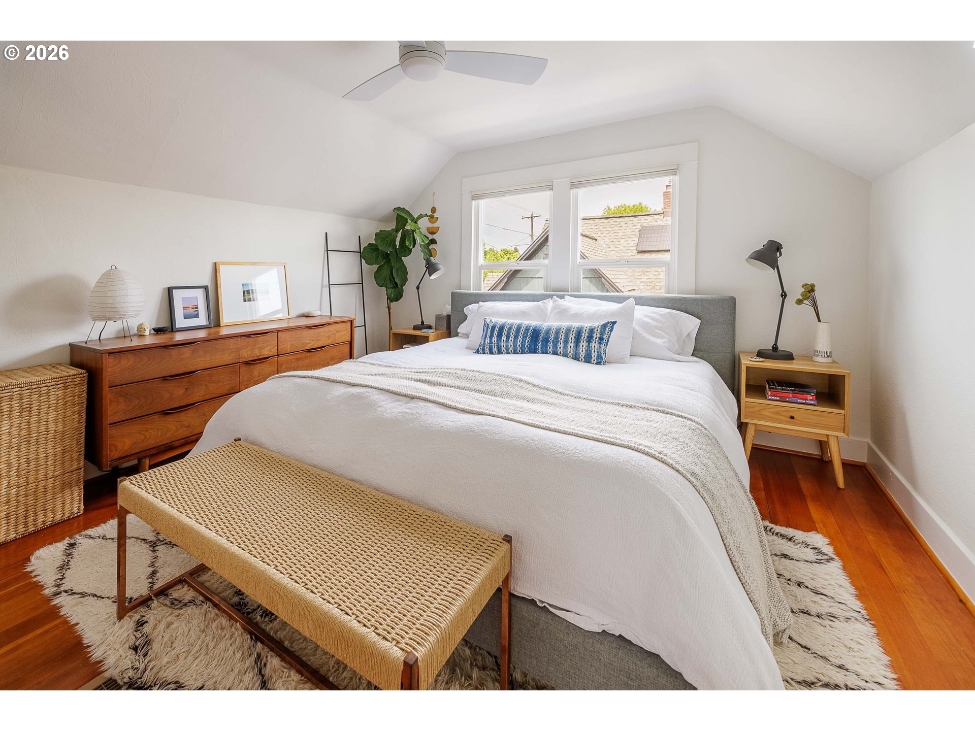 6128 North Denver Avenue Portland, OR 97217 - Photo 20 of 32 a bedroom with a bed and a table
