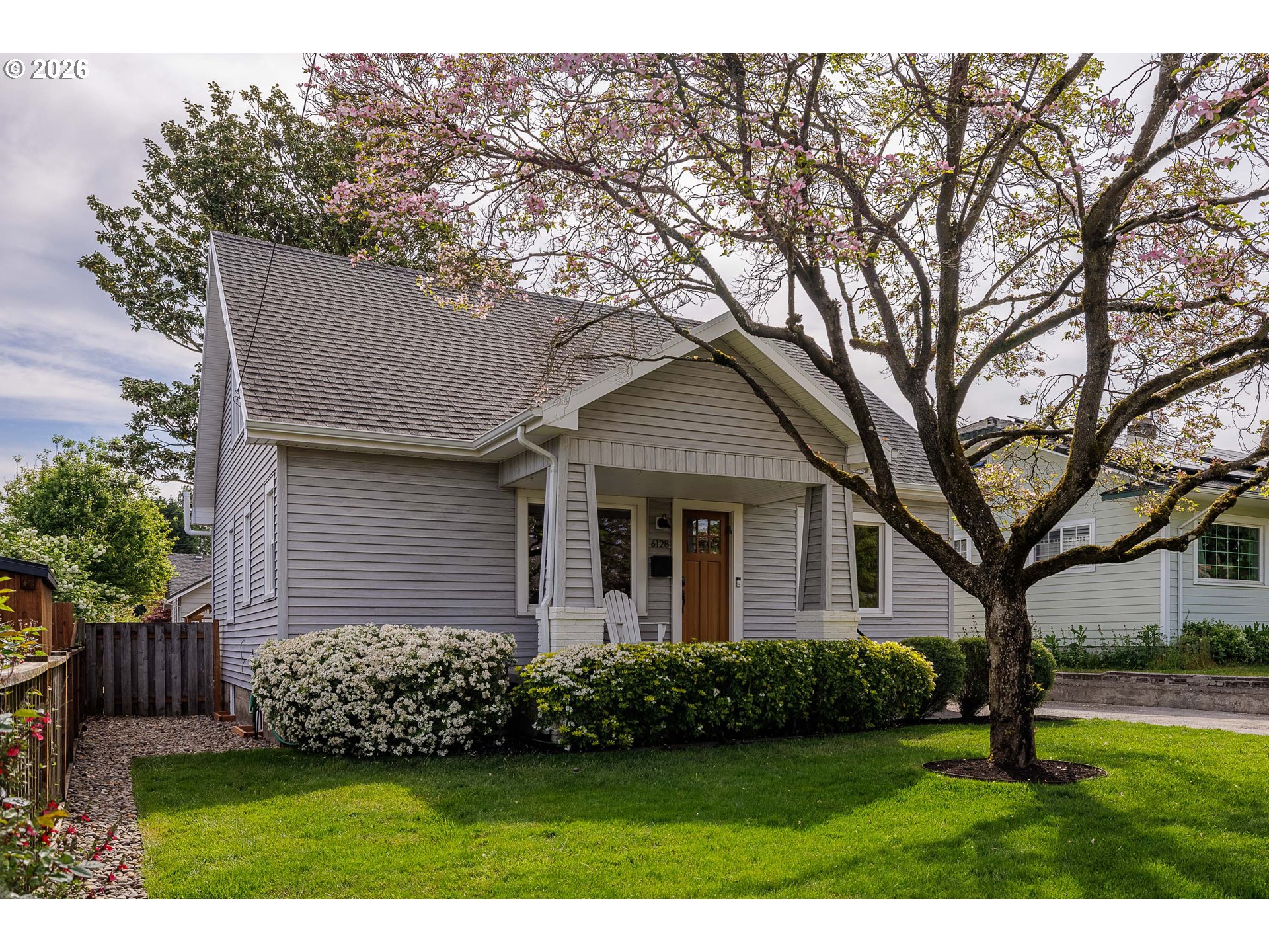 6128 North Denver Avenue Portland, OR 97217 - Photo 2 of 32 a front view of a house with a garden