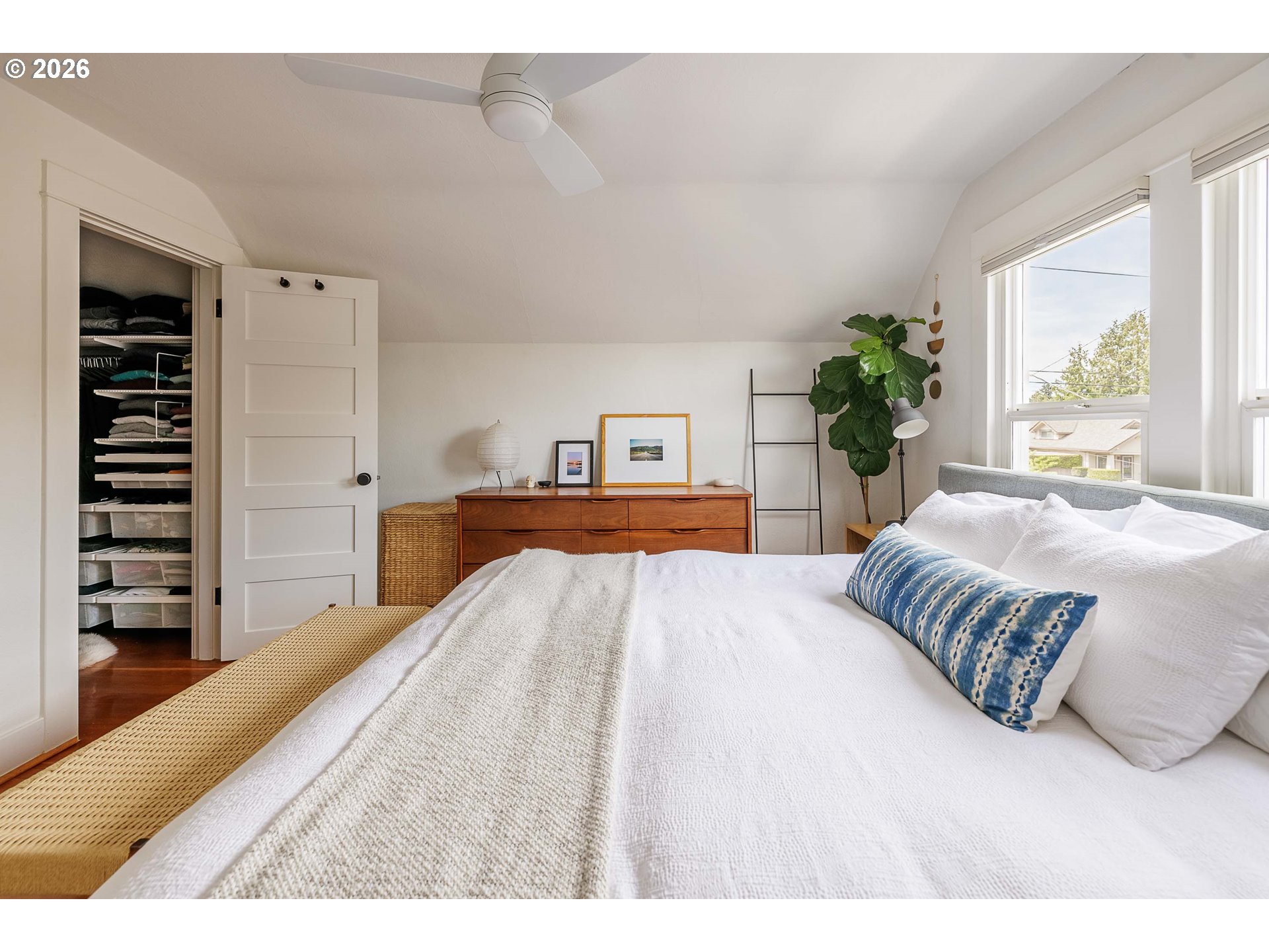 6128 North Denver Avenue Portland, OR 97217 - Photo 21 of 32 a bedroom with a large bed and a couch