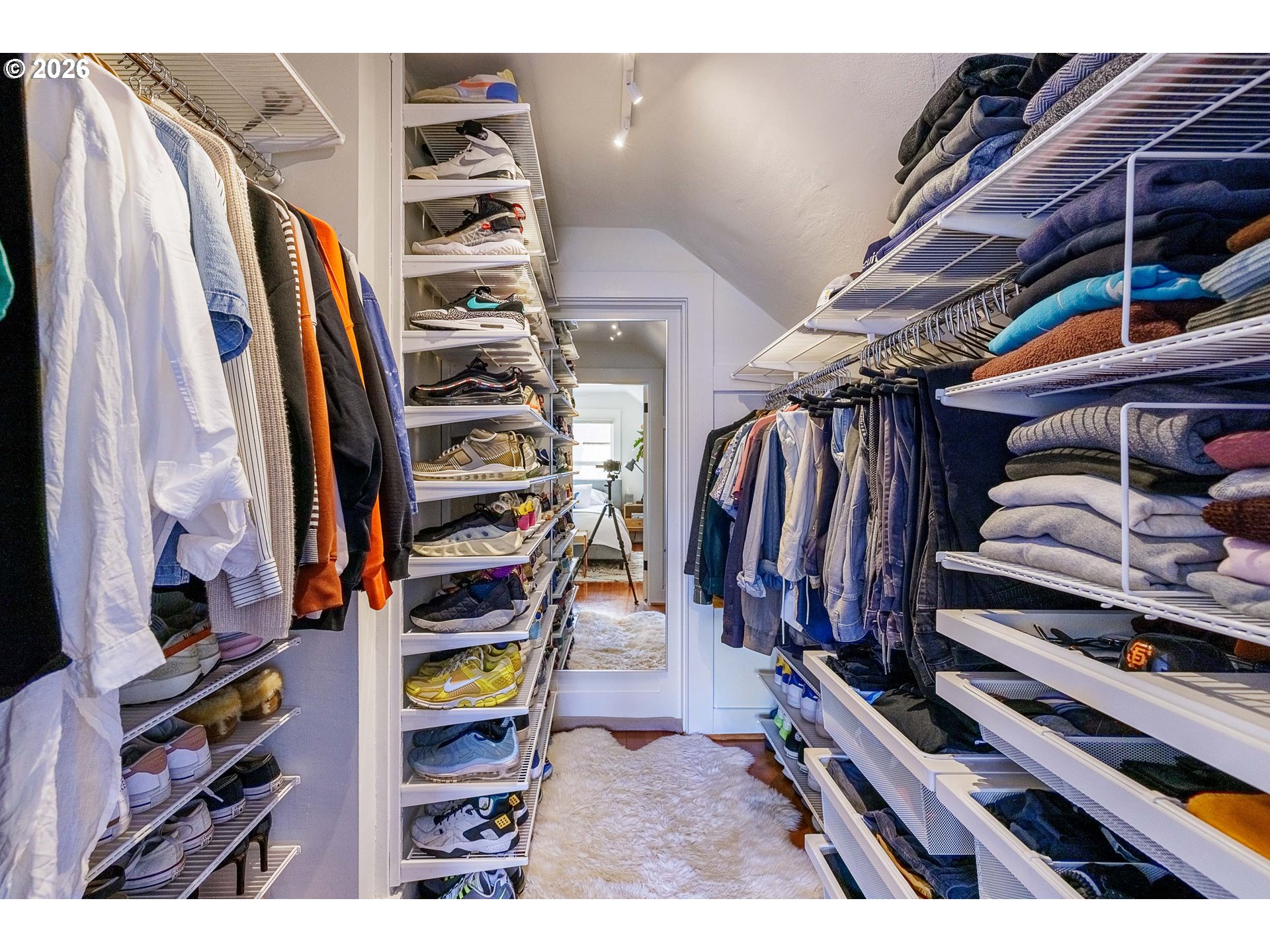 6128 North Denver Avenue Portland, OR 97217 - Photo 22 of 32 a view of walk in closet with clothes and shoes