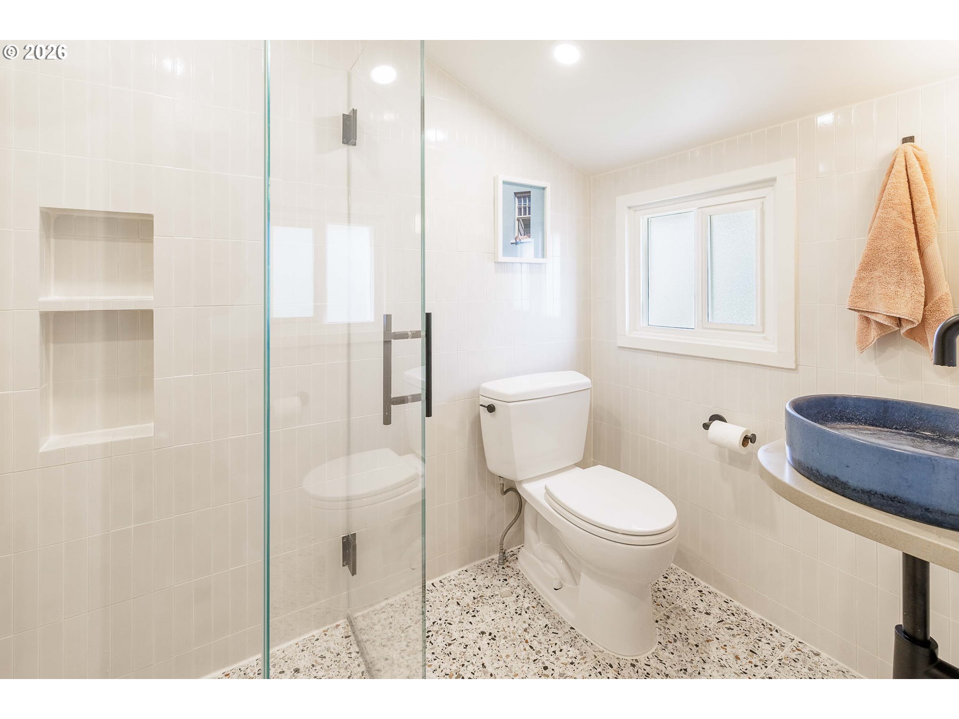 6128 North Denver Avenue Portland, OR 97217 - Photo 25 of 32 a bathroom with a toilet a sink and a mirror