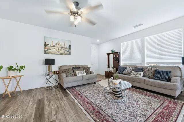 a living room with furniture and a rug