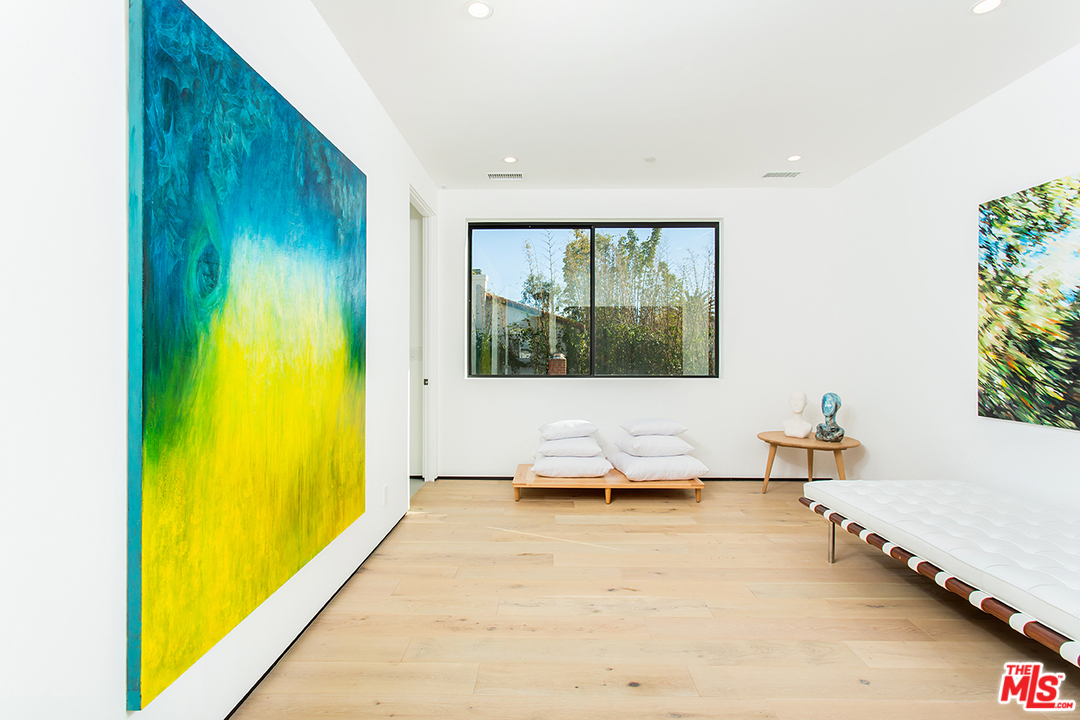 2021 Walnut Avenue Venice, CA 90291 - Photo 16 of 26 a living room with a couch and chandelier
