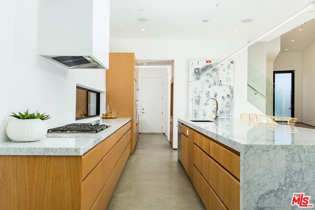2021 Walnut Avenue Venice, CA 90291 - Photo 4 of 26 a kitchen with stainless steel appliances granite countertop a sink and a stove