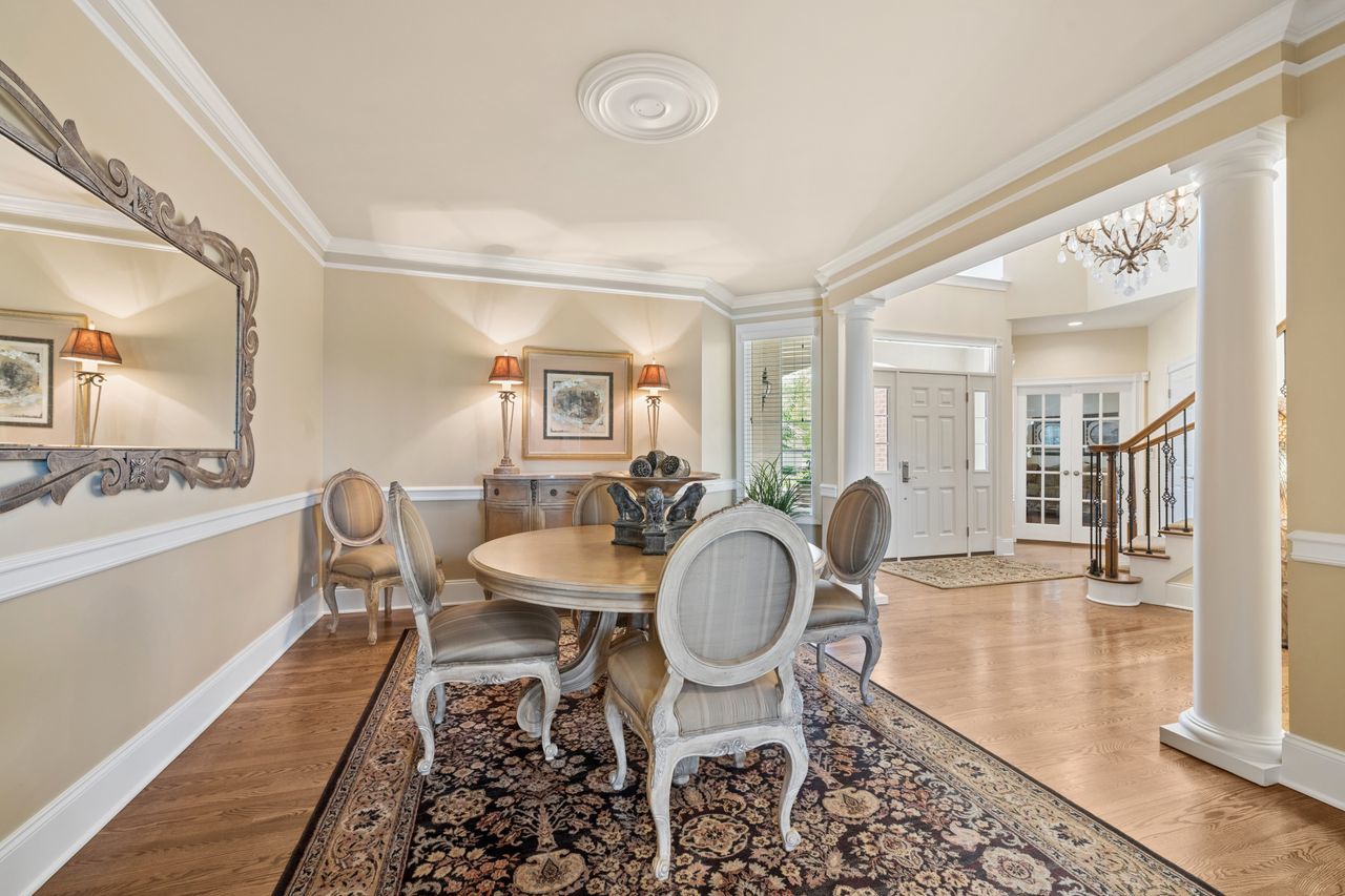 1029 Ridgeview Drive Inverness, IL 60010 - Photo 10 of 58 a dining room with wooden floor and a dining table