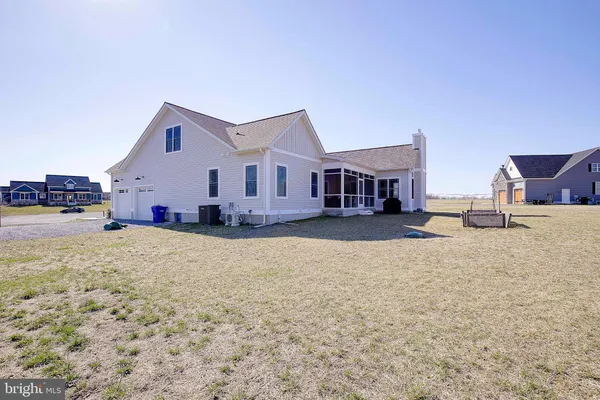 a view of the house with a yard