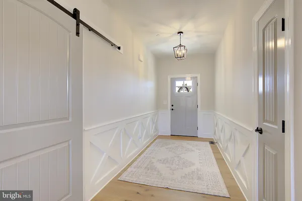 a view of a hallway view with staircase