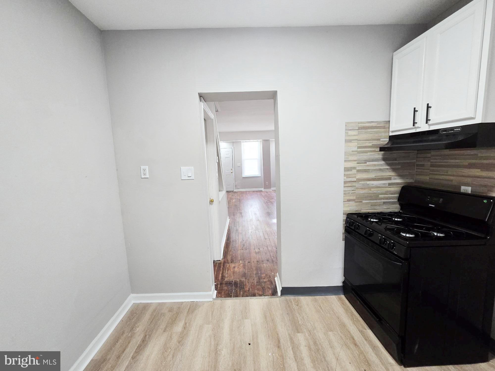 1910 Sigel Street Philadelphia, PA 19145 - Photo 11 of 25 a view of a kitchen from the hallway