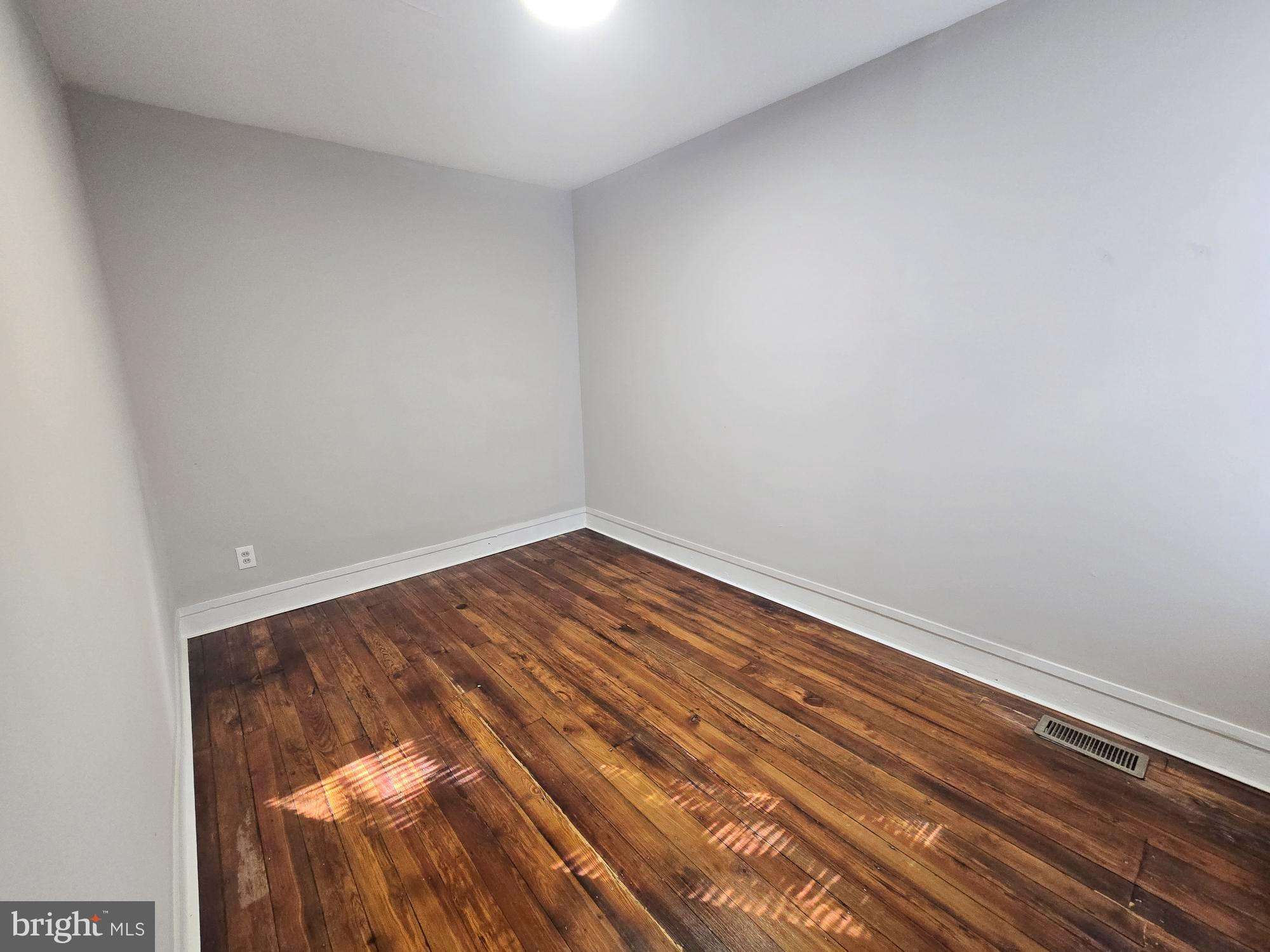 1910 Sigel Street Philadelphia, PA 19145 - Photo 16 of 25 a view of a room with wooden floor
