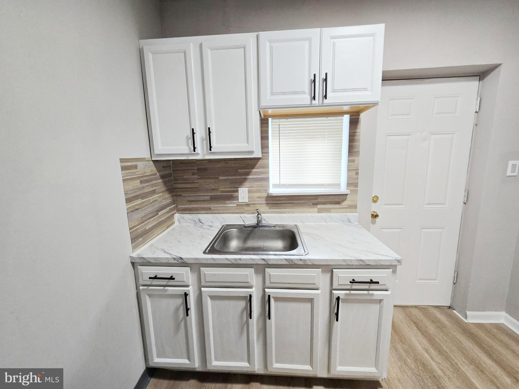 1910 Sigel Street Philadelphia, PA 19145 - Photo 9 of 25 a kitchen with stainless steel appliances granite countertop a sink and dishwasher