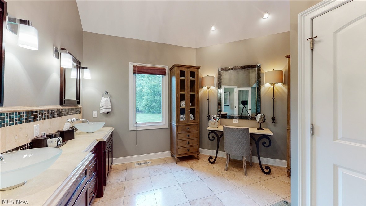7070 Granite Ridge Chagrin Falls, OH 44023 - Photo 15 of 34 Marble bath with dual sinks, private commode and custom-built vanity with Restoration Hardware sconces