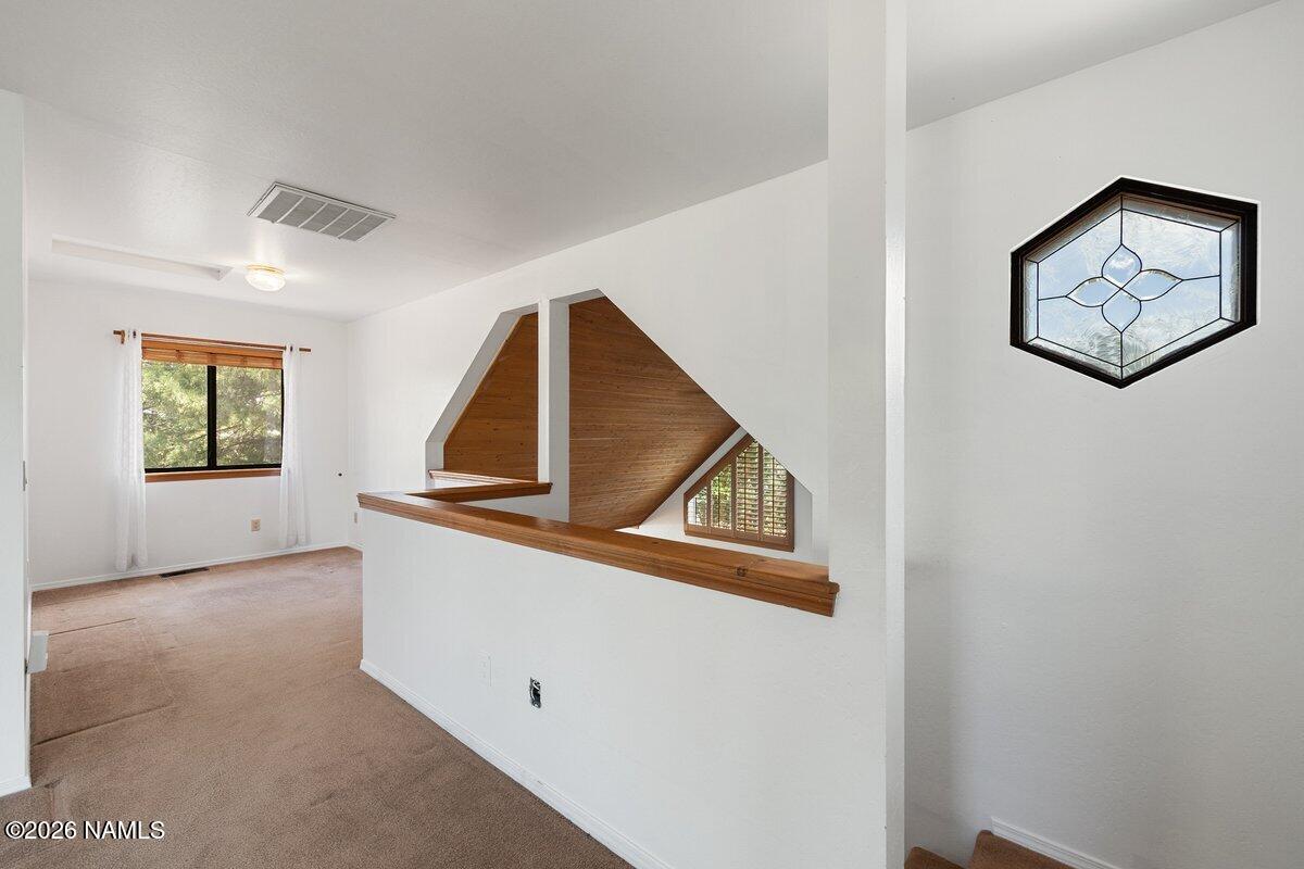 5535 East Western Star Road Flagstaff, AZ 86004 - Photo 23 of 49 a view of a hallway with windows