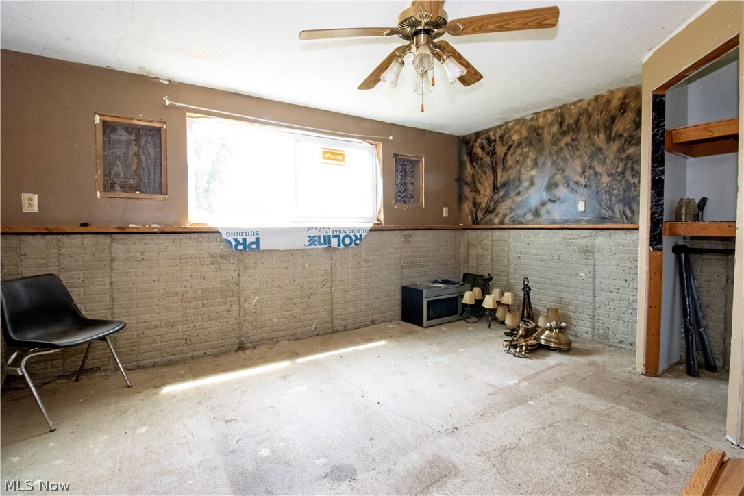 5660 Force Road Shreve, OH 44676 - Photo 34 of 38 Bedroom with ceiling fan, and concrete floors