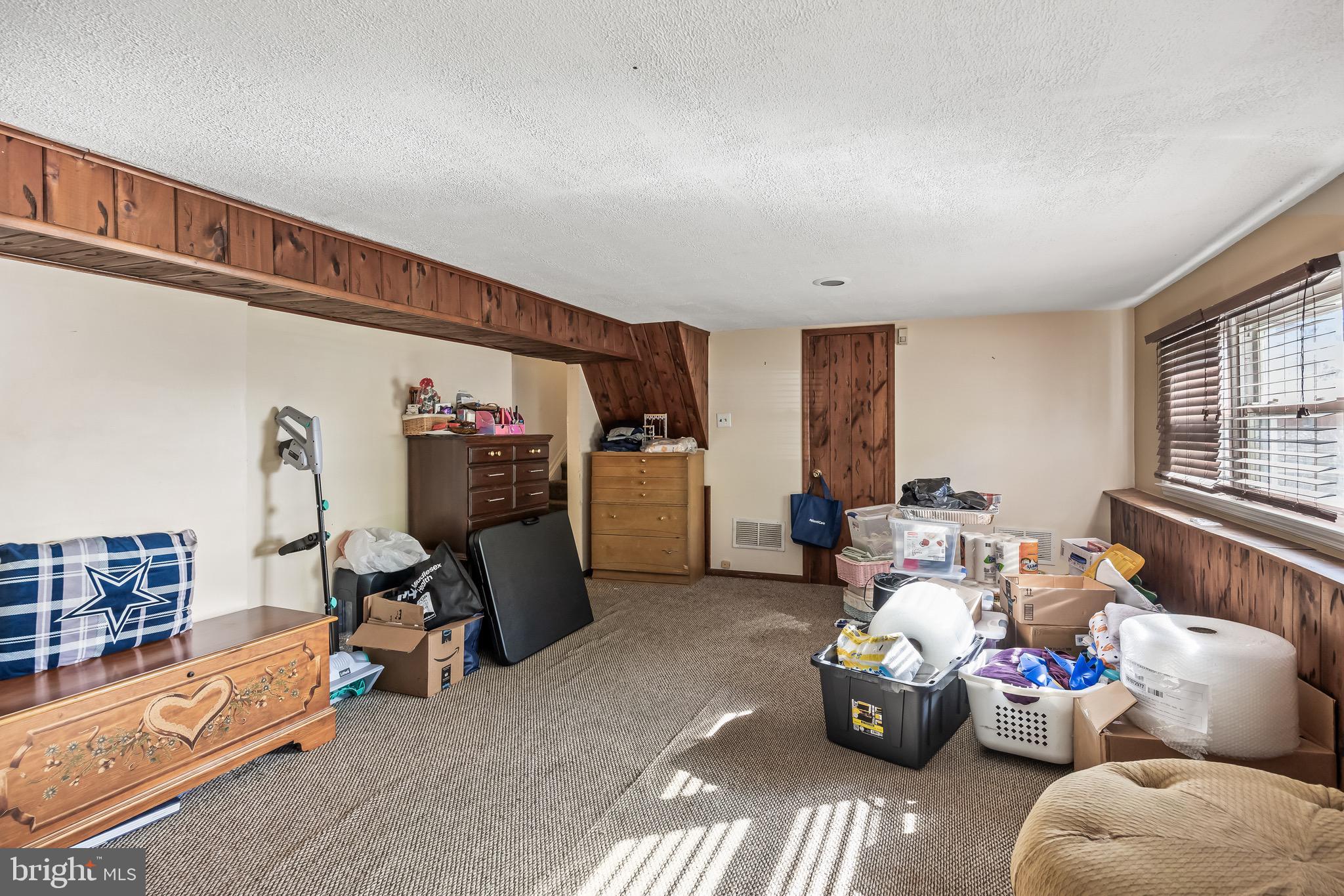 109 North Ambler Road Somers Point, NJ 08244 - Photo 18 of 22 a living room with furniture toys and a window