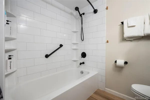 a bathroom with a bathtub and a shower