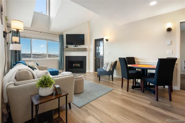 a living room with furniture fireplace and a flat screen tv