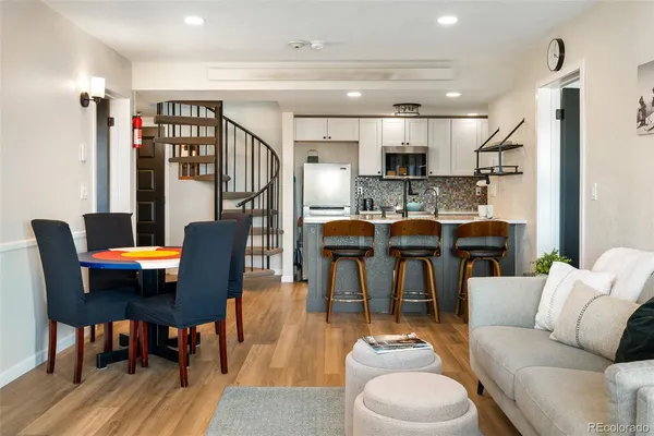 a view of a dining room with furniture and wooden floor