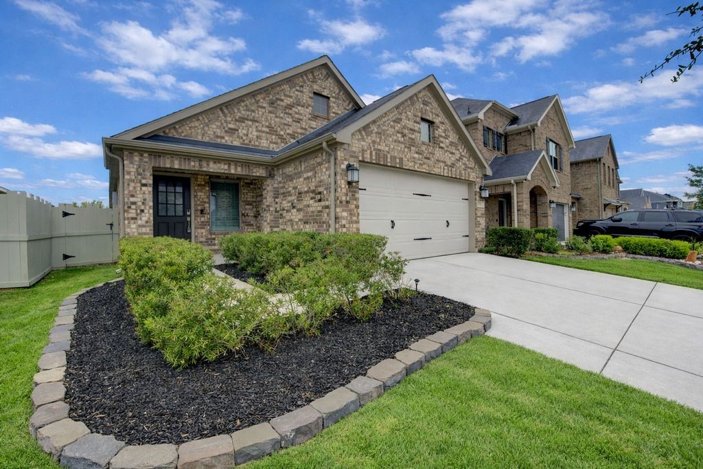 Beautiful brick facade invites you to call this house your home.