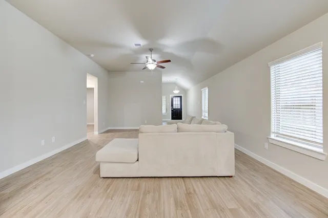 a white bath tub sitting in a room next to a bathroom