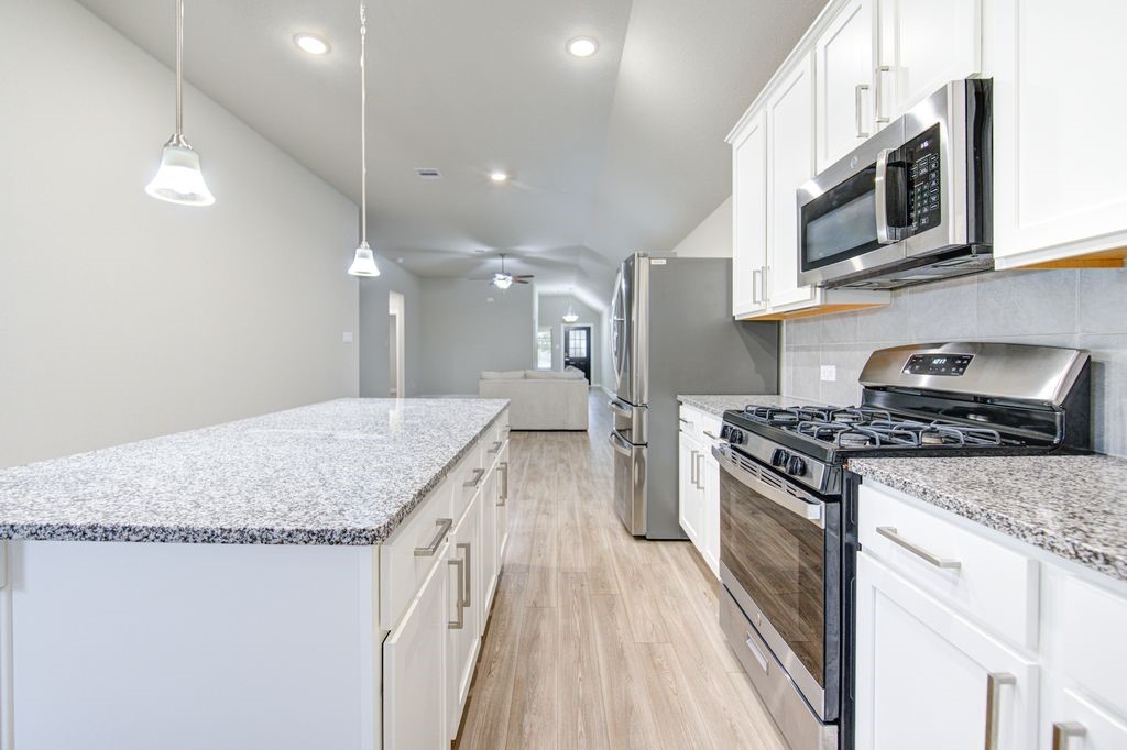 17692 Tree Of Heaven Conroe, TX 77385 - Photo 18 of 50 The chef in your family will love the island kitchen.