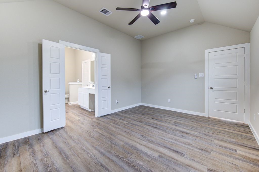 17692 Tree Of Heaven Conroe, TX 77385 - Photo 24 of 50 View towards the entrance of the main bedroom and primary bathroom.