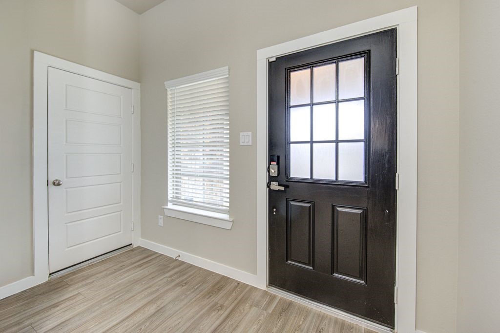 17692 Tree Of Heaven Conroe, TX 77385 - Photo 5 of 50 To the right in the entrance hall, you will find the access door to your garage.