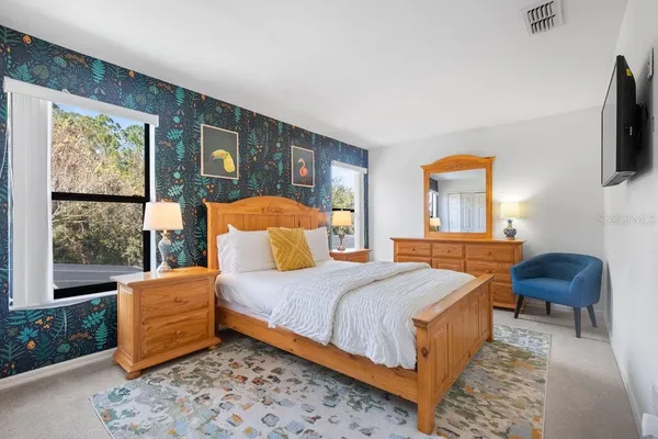 a bedroom with bed and a fireplace