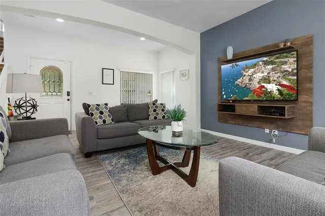 a living room with furniture and a large window