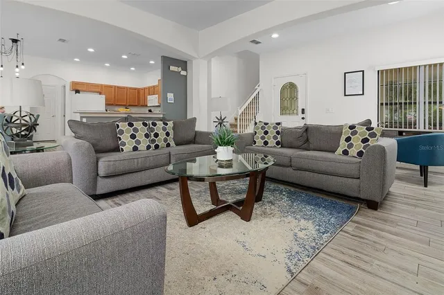 a living room with furniture and a large window