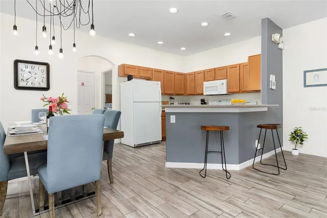 a kitchen with a sink stove and refrigerator