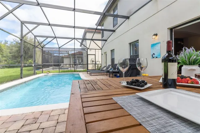 a view of a swimming pool with lounge chair