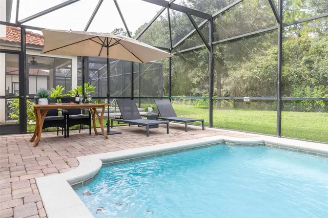 a view of a backyard with a sitting area and furniture