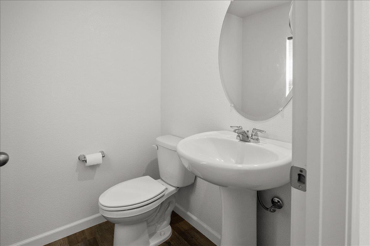 18462 Waterfront Way Lathrop, CA 95330 - Photo 17 of 50 a bathroom with a sink toilet and a mirror