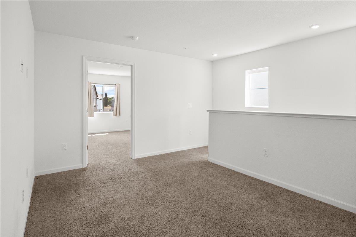 18462 Waterfront Way Lathrop, CA 95330 - Photo 20 of 50 an empty room with windows