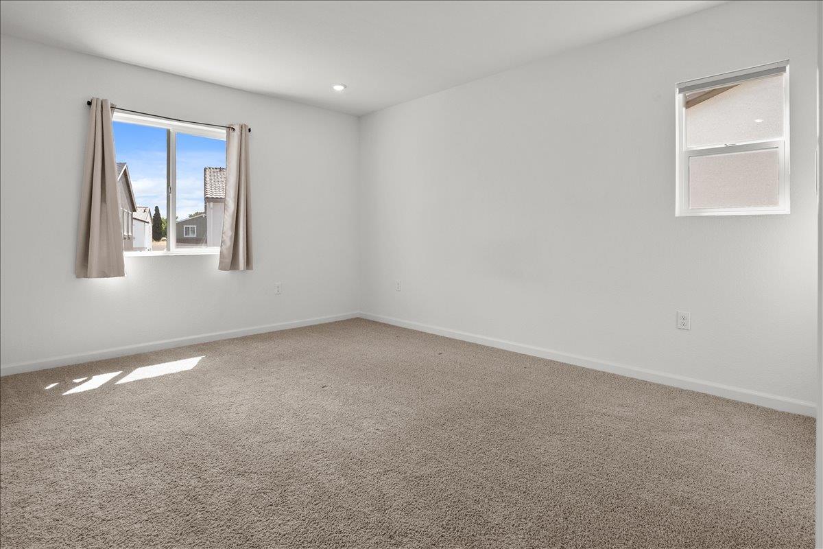 18462 Waterfront Way Lathrop, CA 95330 - Photo 22 of 50 a view of an empty room with a window