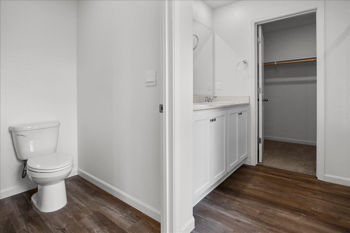 18462 Waterfront Way Lathrop, CA 95330 - Photo 27 of 50 a view of a hallway with toilet and a sink