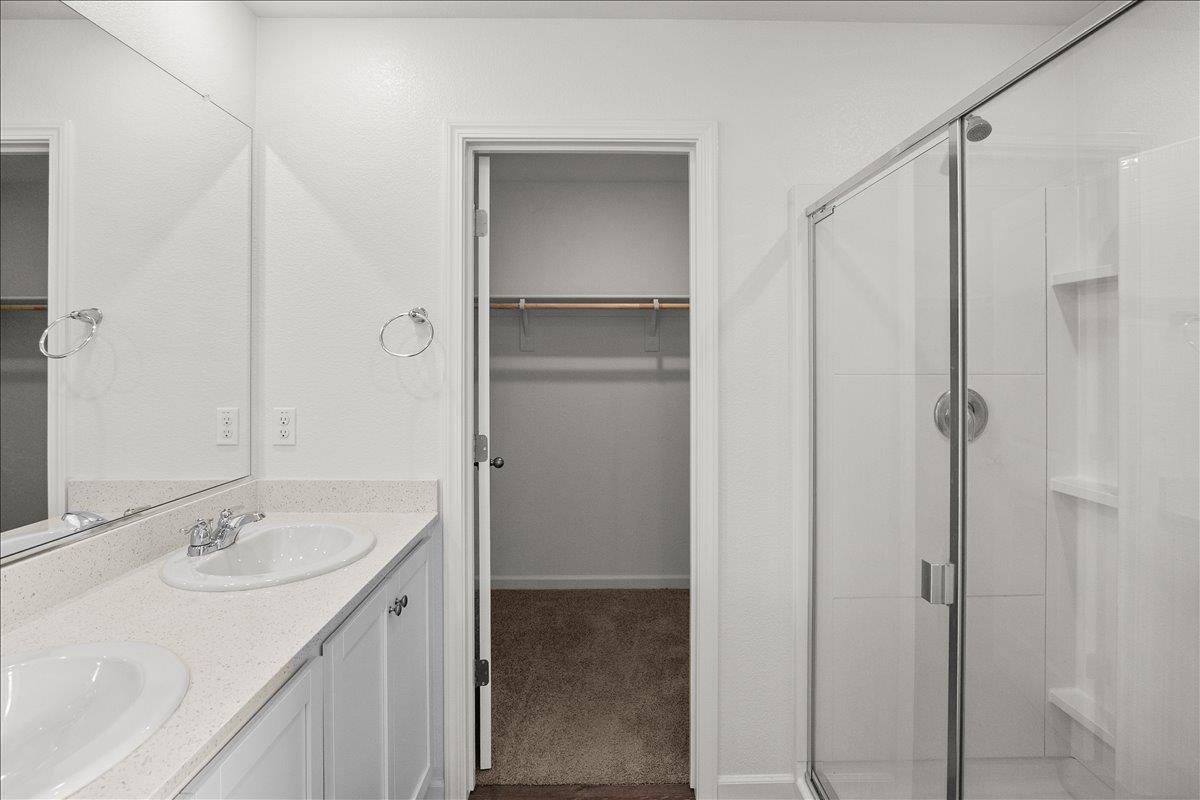 18462 Waterfront Way Lathrop, CA 95330 - Photo 28 of 50 a bathroom with a sink and mirror