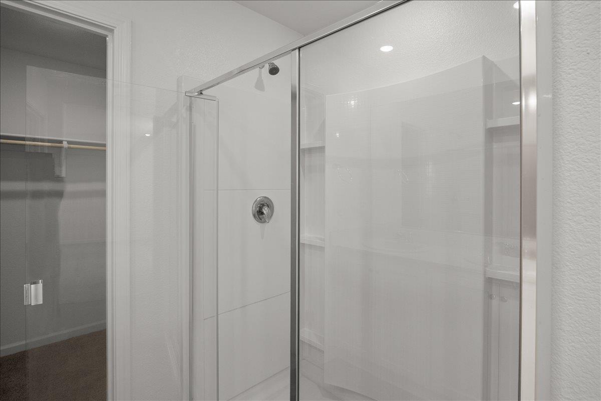 18462 Waterfront Way Lathrop, CA 95330 - Photo 30 of 50 a bathroom with a shower and a glass door