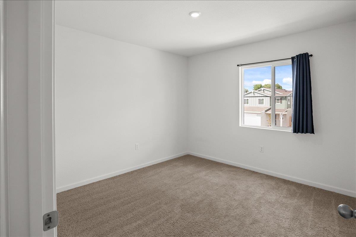 18462 Waterfront Way Lathrop, CA 95330 - Photo 33 of 50 an empty room with windows