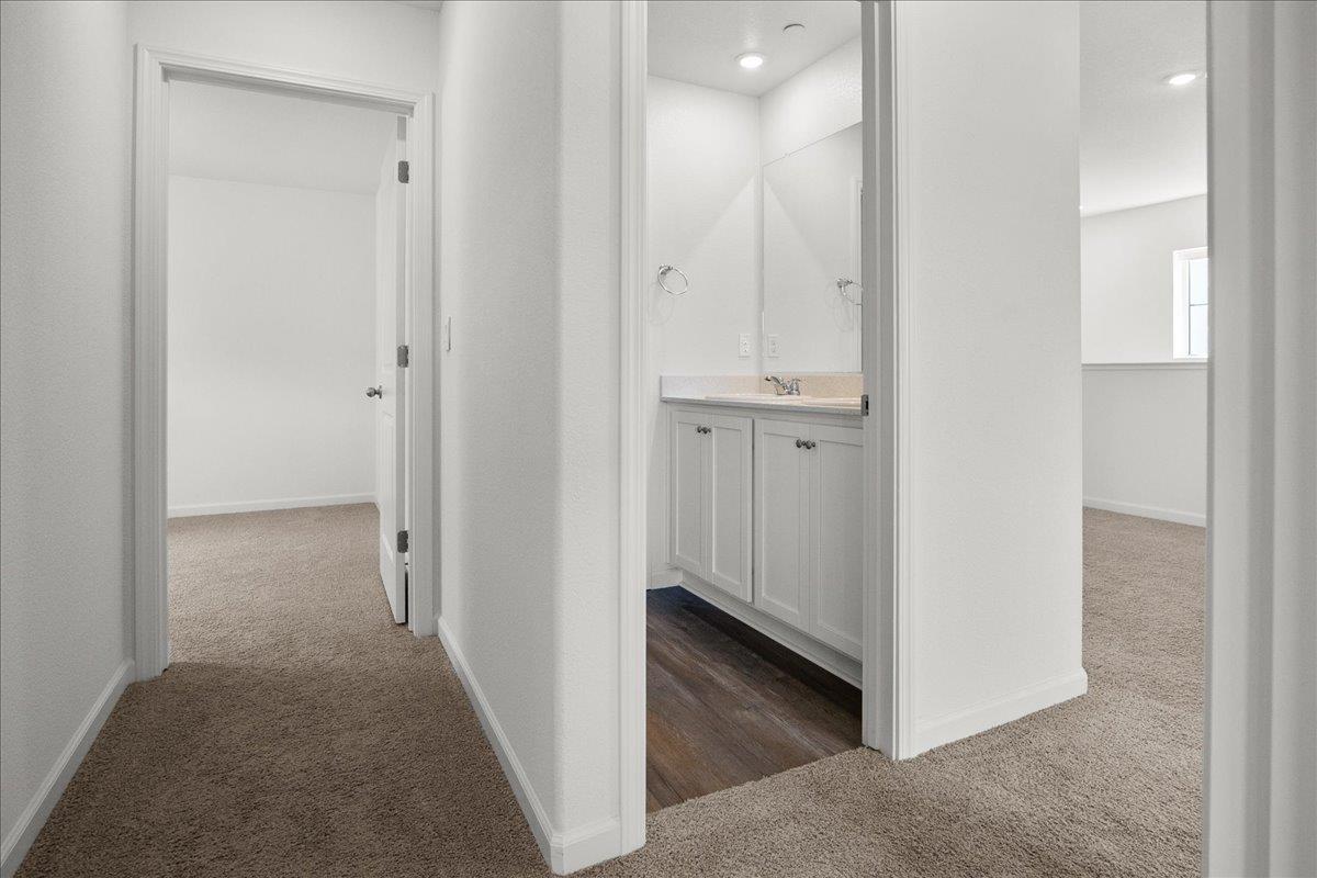 18462 Waterfront Way Lathrop, CA 95330 - Photo 36 of 50 a view of a hallway with two rooms