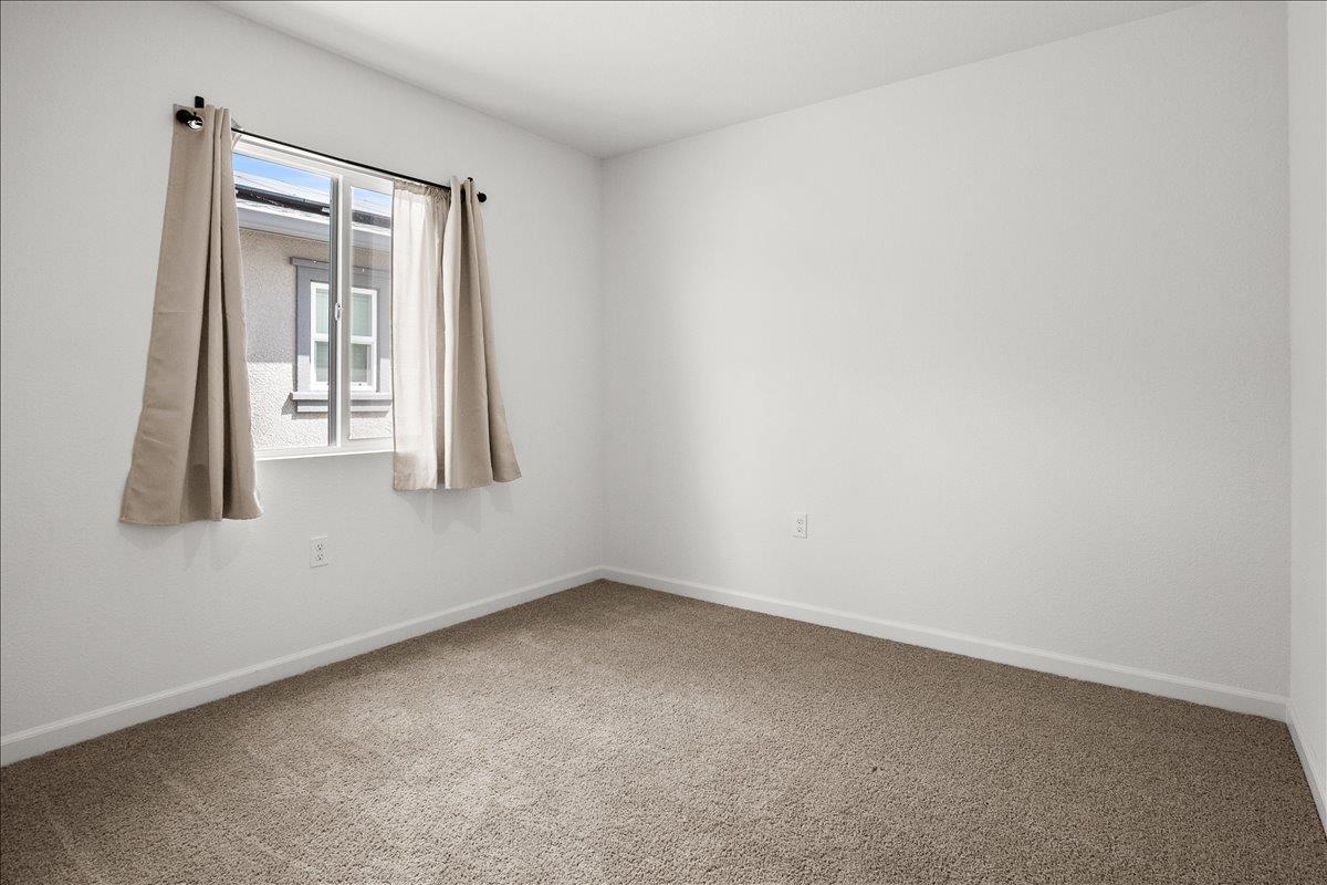 18462 Waterfront Way Lathrop, CA 95330 - Photo 41 of 50 an empty room with a window