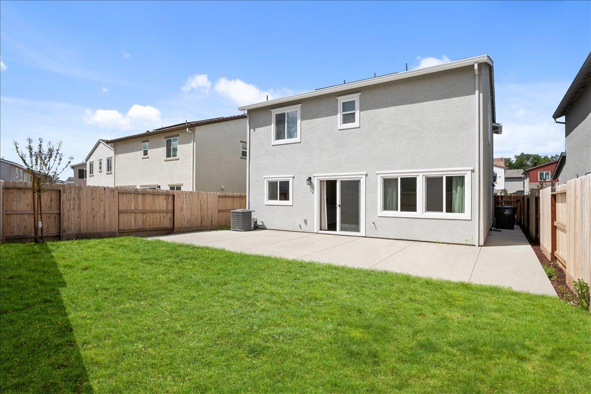 18462 Waterfront Way Lathrop, CA 95330 - Photo 46 of 50 a front view of a house with a yard