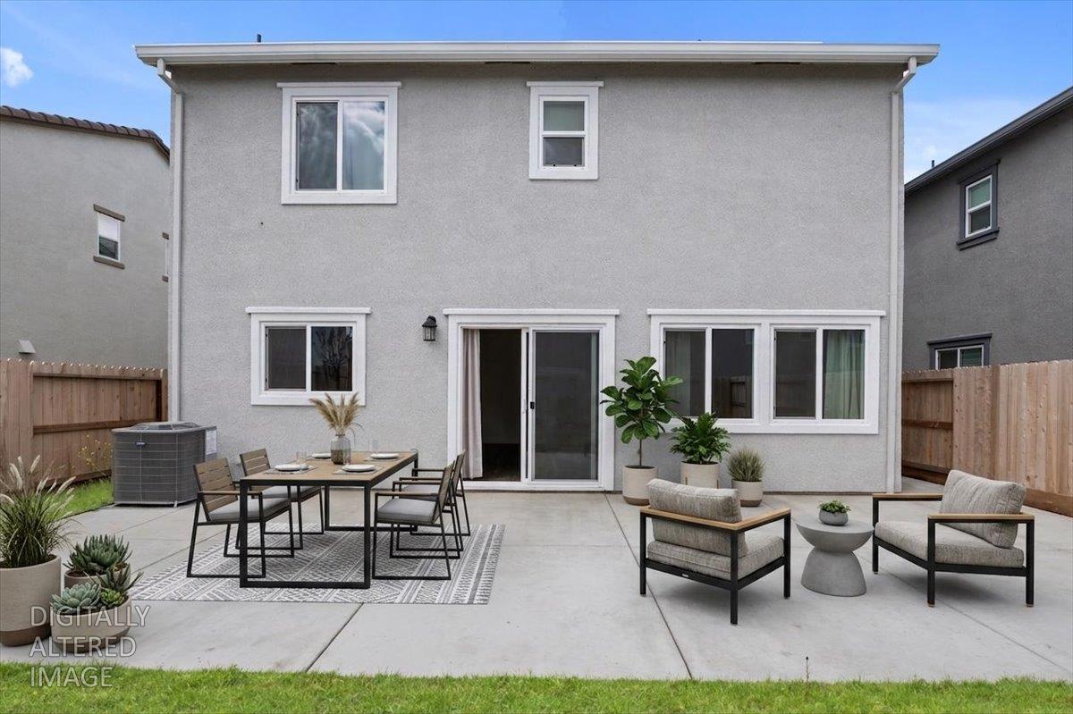 18462 Waterfront Way Lathrop, CA 95330 - Photo 48 of 50 a view of a house with patio and a yard