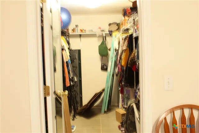 a bathroom with a sink toilet double vanity and shower
