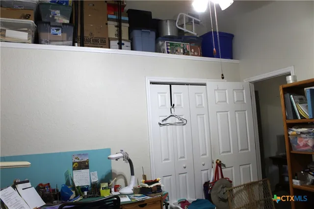 a living room with furniture a dining table and a chandelier