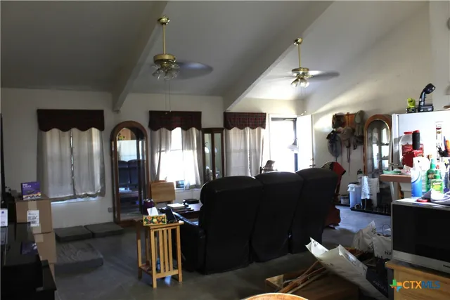 a front view of house with yard outdoor seating and covered with green space