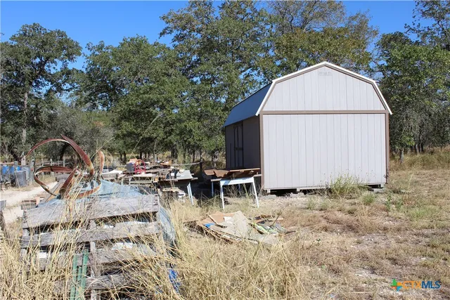 a backyard of a house with outdoor seating