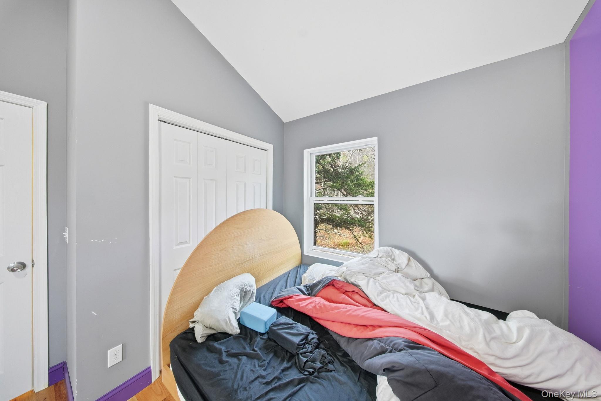 52 Martins Road Huguenot, NY 12746 - Photo 13 of 26 a bedroom with a bed and a window