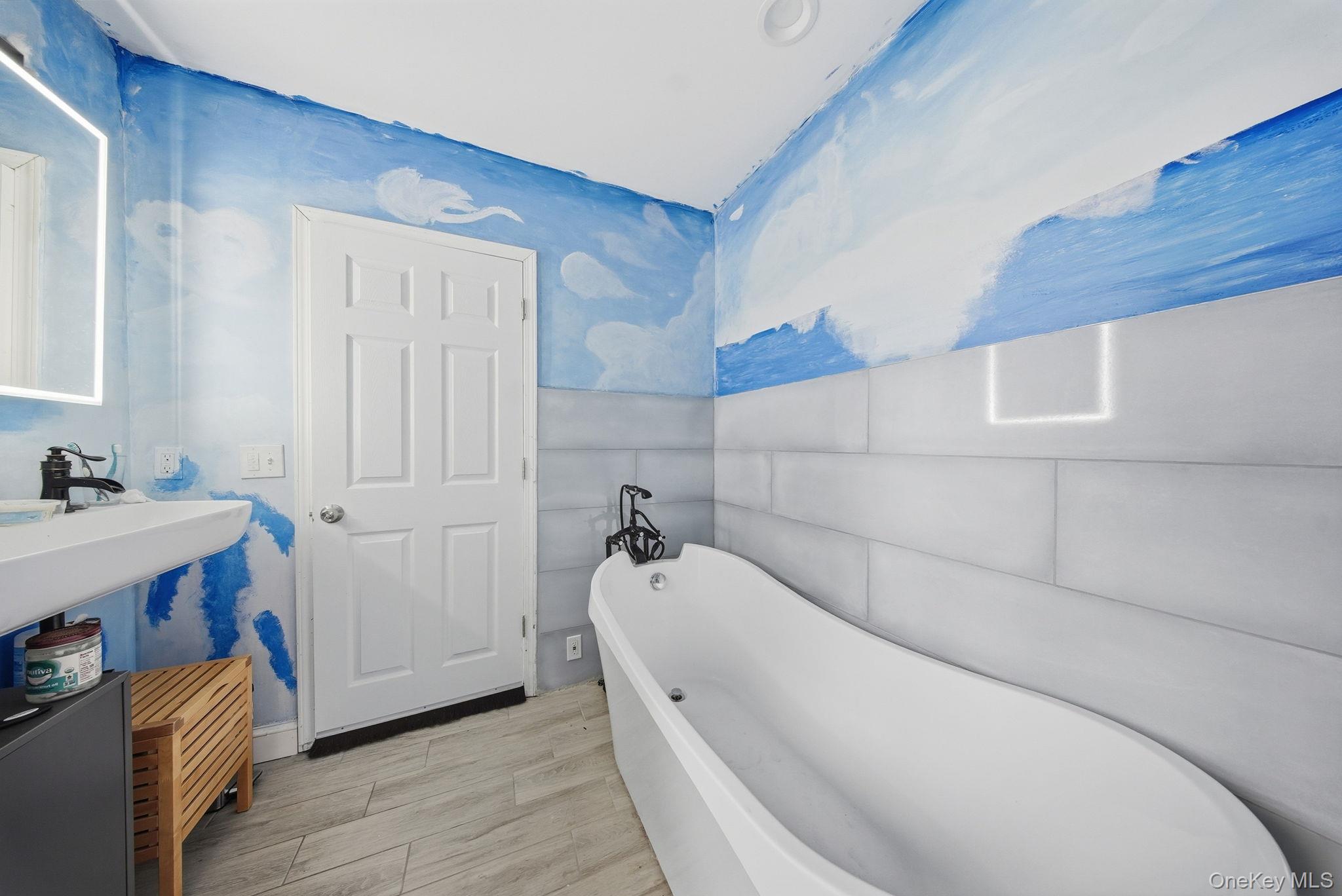 52 Martins Road Huguenot, NY 12746 - Photo 16 of 26 a bathroom with a tub and a sink