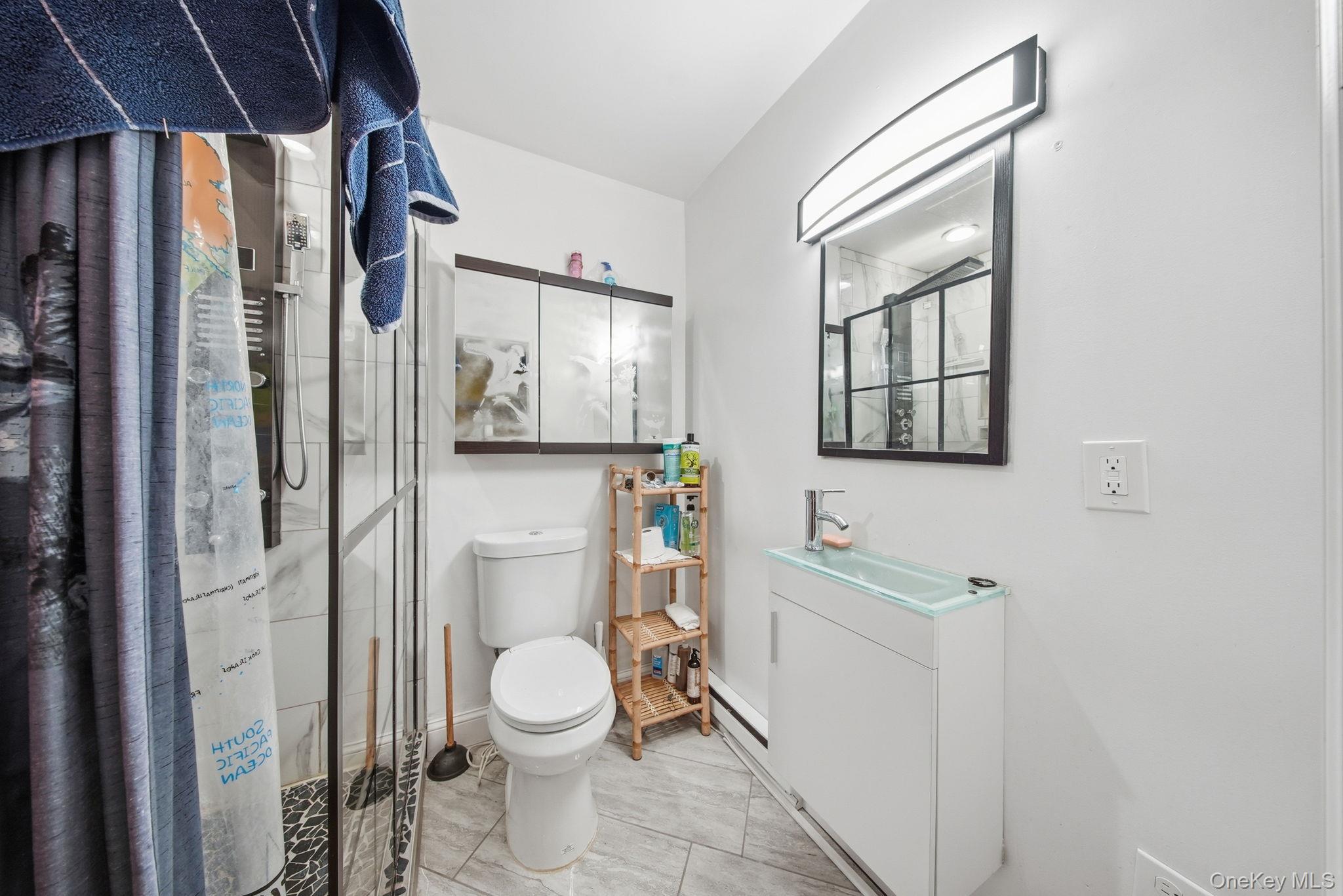 52 Martins Road Huguenot, NY 12746 - Photo 19 of 26 a bathroom with a toilet sink and shower